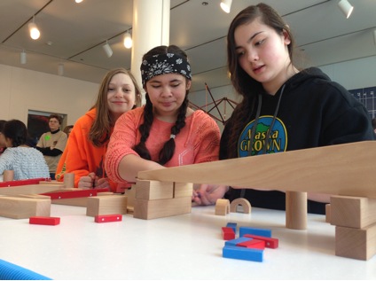 Visitors practice collaboration end engineering skills in Spark!Lab at the Anchorage Museum. 