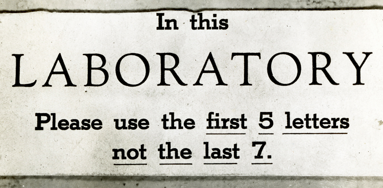 IBM Science Laboratory sign reading, "In this laboratory, please use the first 5 letters, not the last seven," meaning more labor and less oratory.