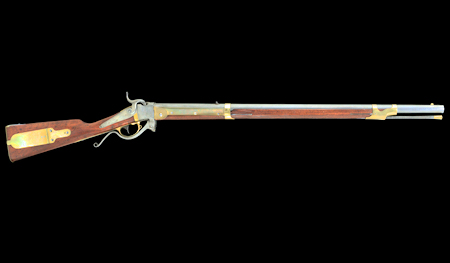 Model for a wood and metal rifle with a very long barrel and a shaft below the barrel for holding a tamping rod. 