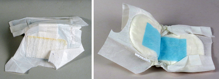 Side-by side photos of disposable diapers for premature infants. On the left is Sharon Rogone’s prototype d.aper and a commercial version from 2007 is on the right. Both show an inner absorbent layer surrounded by soft gauze-like material.