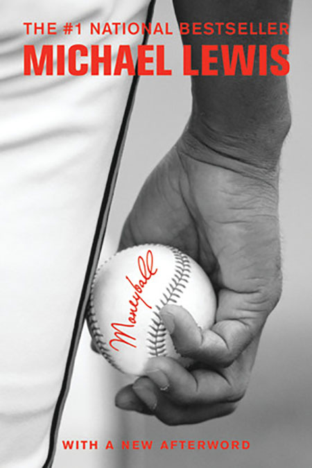 Cover of the book Moneyball, showing a closeup of a baseball player’s hand holding a baseball.