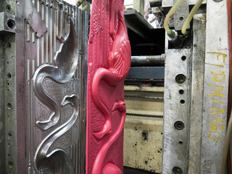 Two halves of a flamingo in the mold.
