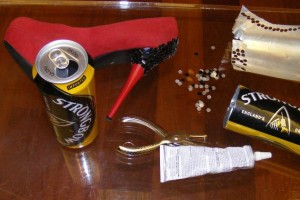 Strongbow kit: cans, vintage shoe, hole punch, glue.