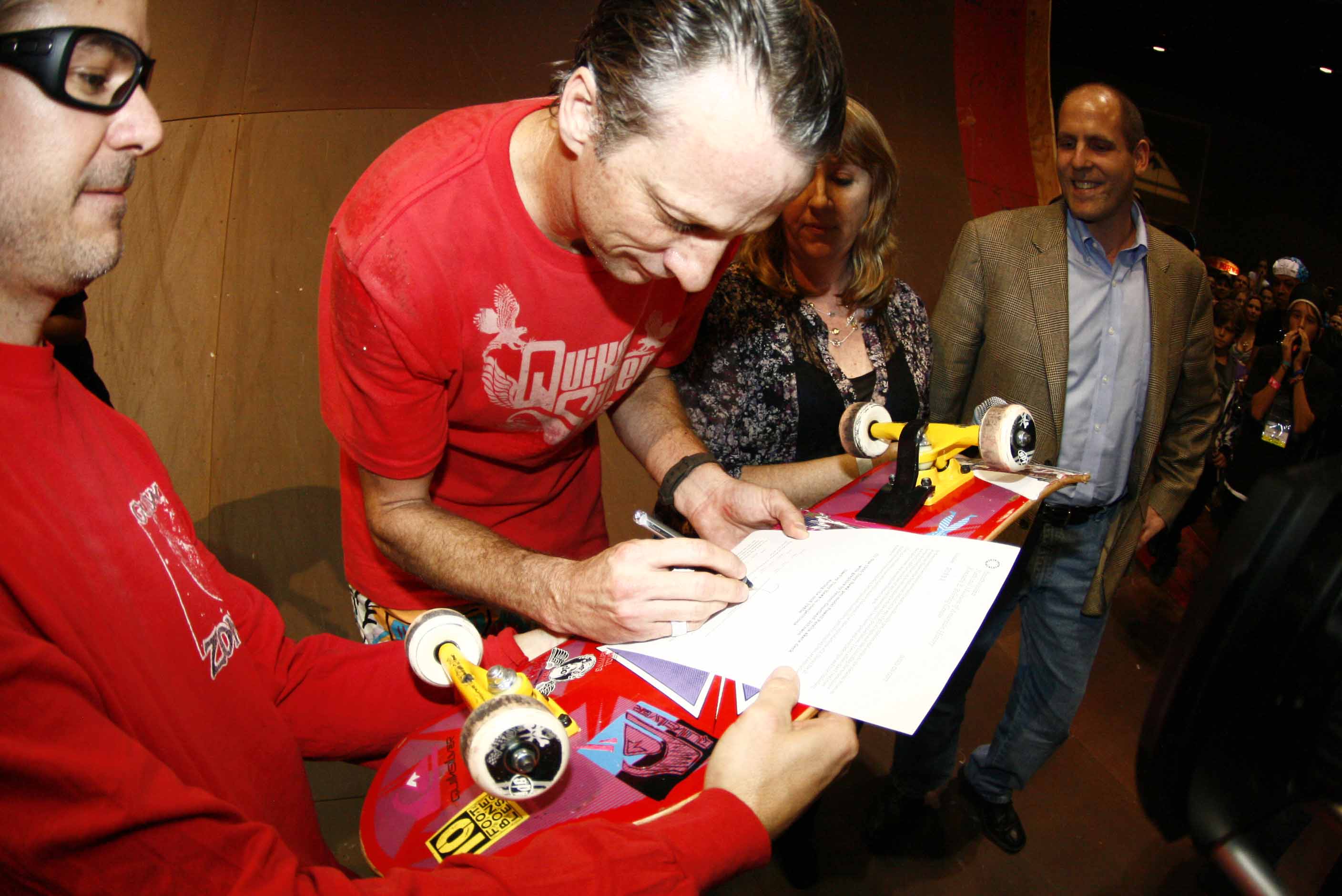 Tony Hawk signs deed of gift while on skate ramp