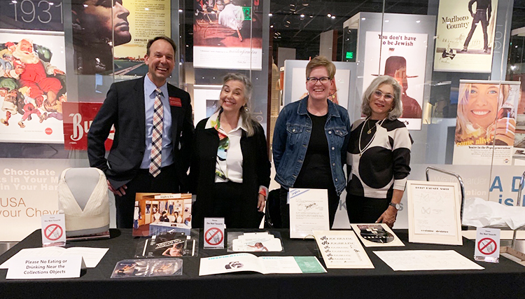 Lemelson staff with inventors Lisa Lindahl and Hinda Miller, at table display of Jogbra archival materials