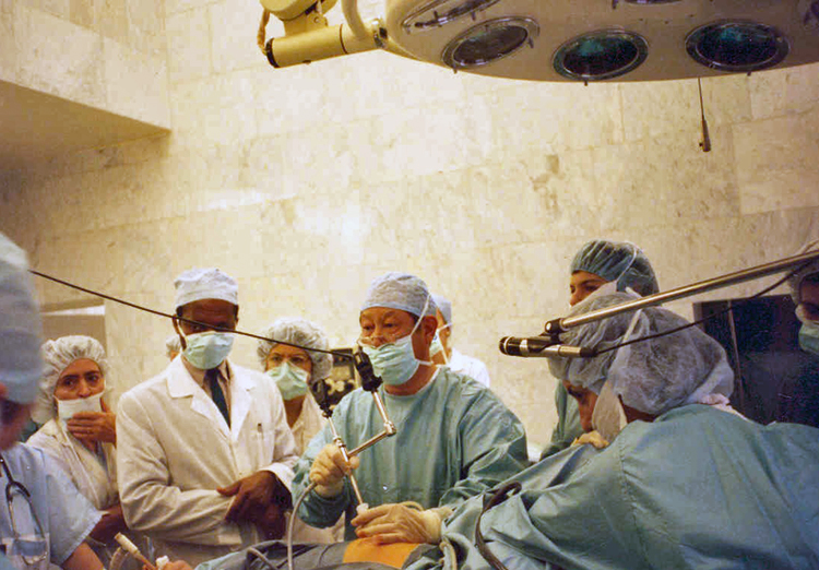 Medical staff working at an operating table