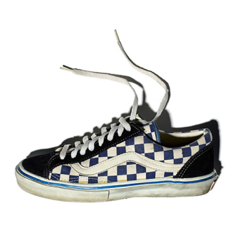 Vans blue and white checked skateboarding shoe with a dark blue suede toe and eyestay, white leather sidestripe, and the trademark deep tan, waffle pattern soles. 