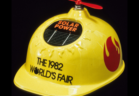 Yellow plastic hard hat with solar-powered propeller on top, souvenir from, Knoxville World’s Fair, 1982