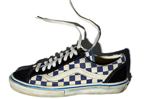 Vans blue and white checked skateboarding shoe with a dark blue suede toe and eyestay, white leather sidestripe, and the trademark deep tan, waffle pattern soles. 