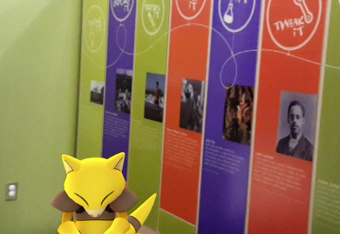  Abra, a Psychic-type Pokémon, sitting near the entrance to Spark!Lab