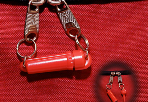 Close-up of the Zip-R-Lok security clasp on a red purse