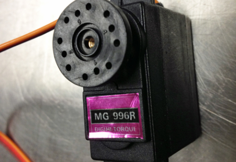 Close-up of a small servo motor labeled MG996R Digihi Torque