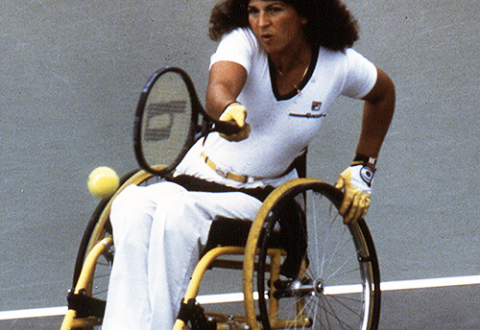 Hamilton playing tennis in a wheelchair