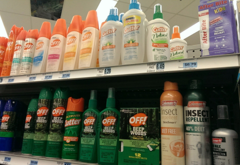 Stock image of insect repellent products on a store shelf.