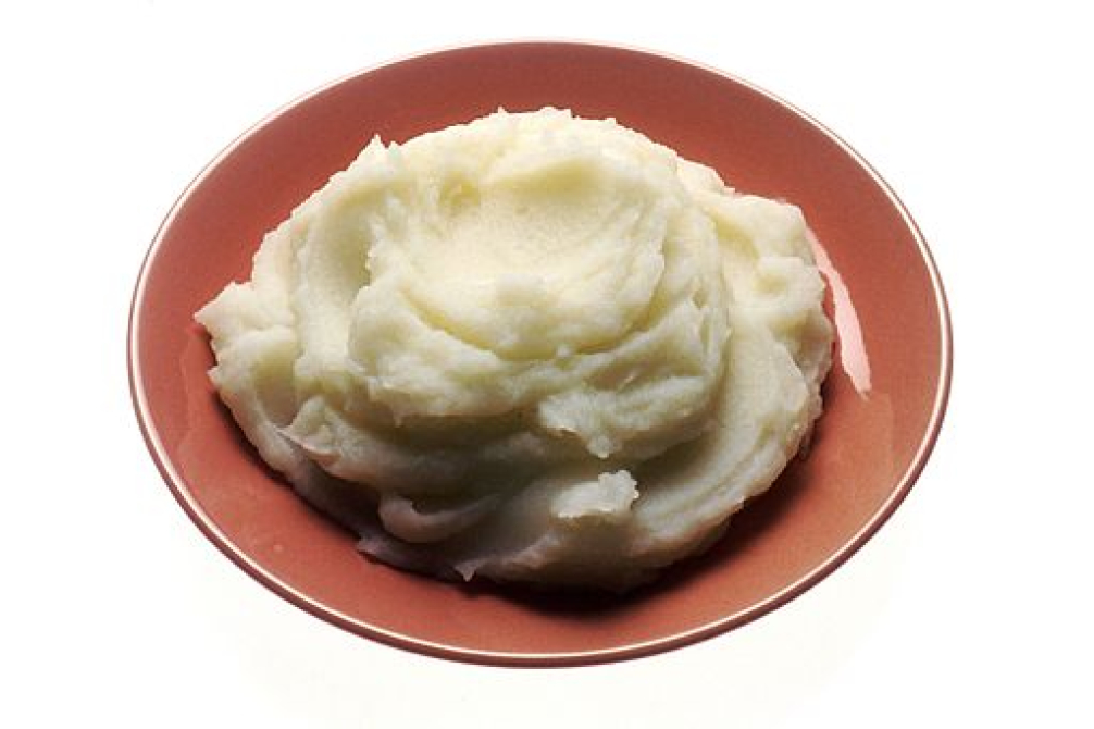 A bowl of mashed potatoes.