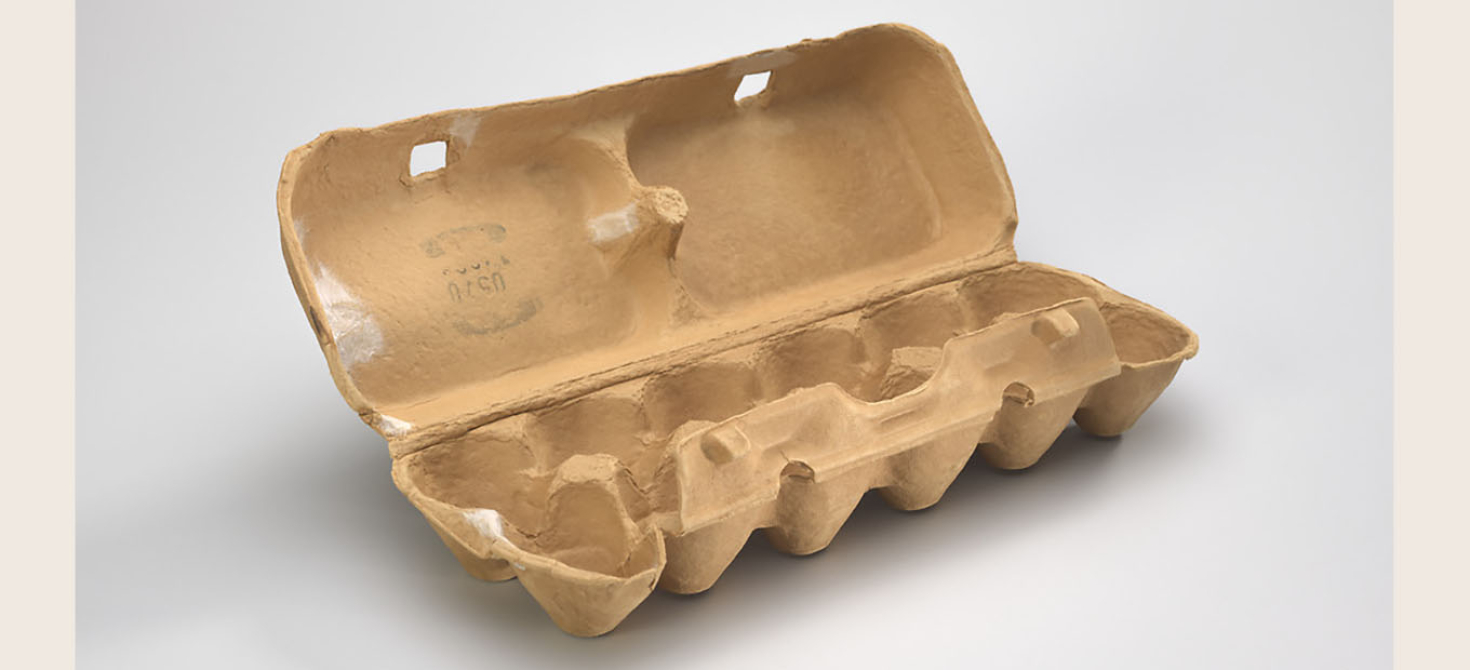 A brown cardboard empty egg carton