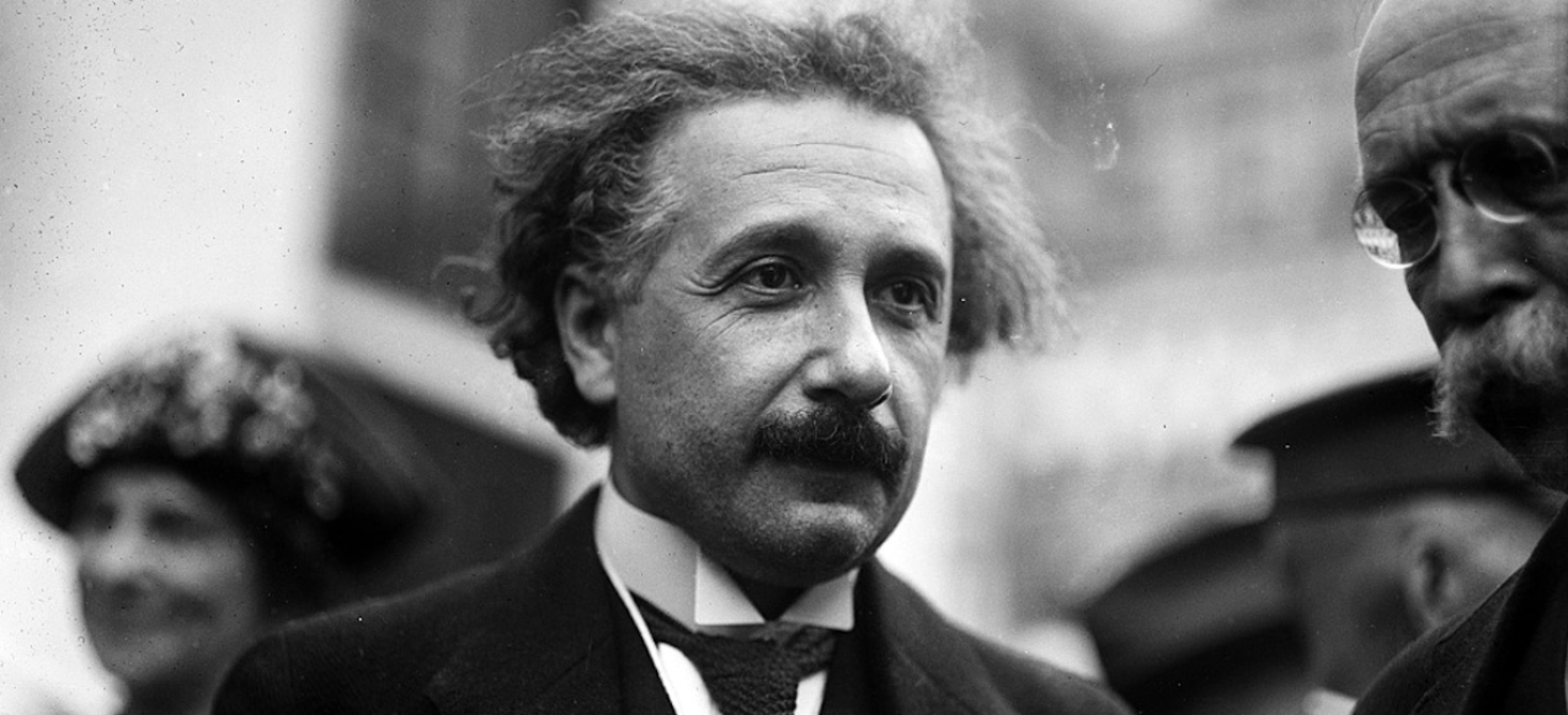 Candid shot of Albert Einstein outside in a crowd