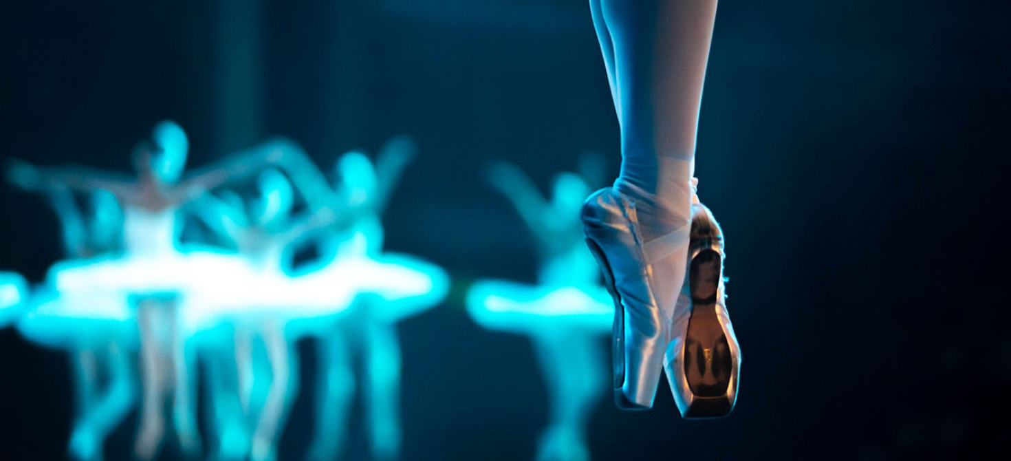 Close-up of a ballerina’s feet showing her pointe shoes during a performance of Swan Lake by the Russian Ballet Theatre