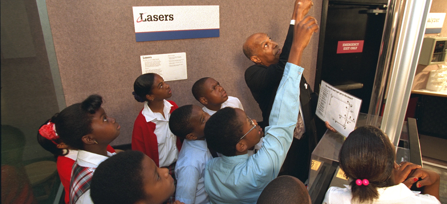 Inventor Hal Walker with students during an Innovative Lives presentation