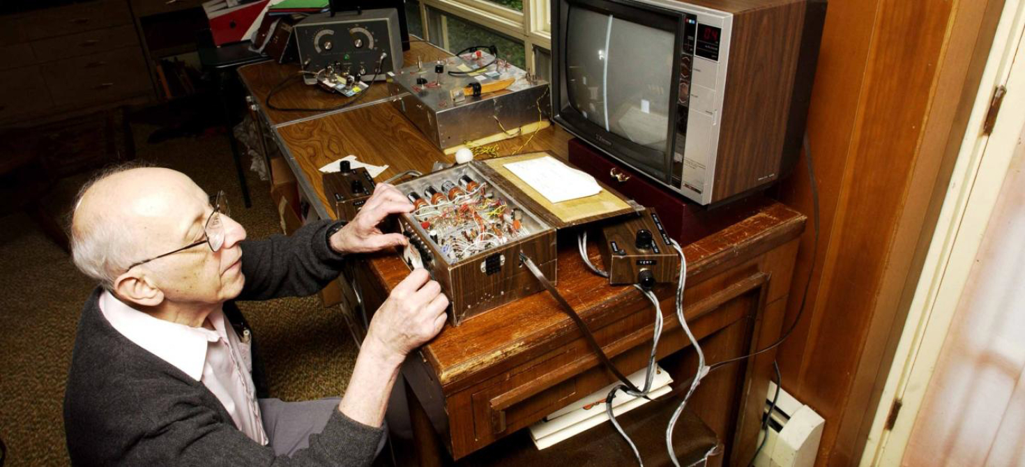 Ralph Baer tinkering with his "Brown Box" 