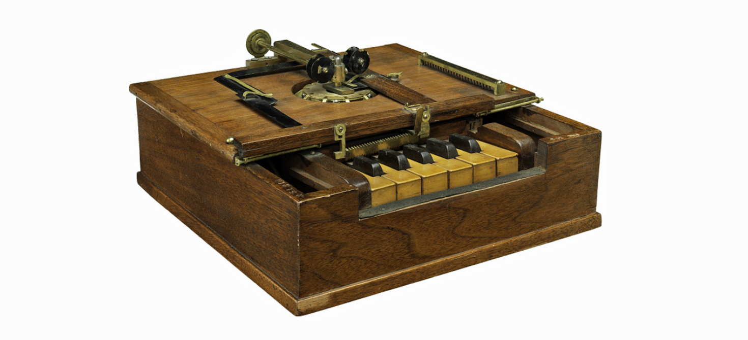 Sholes, Glidden, and Soule 1868 typewriter patent model showing 11 keys, 6 white and 5 black