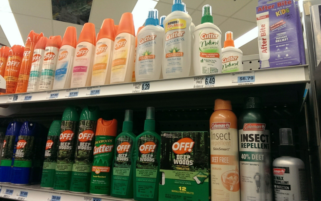 Stock image of insect repellent products on a store shelf.