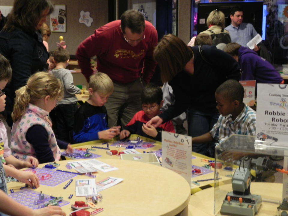 Families doing an activity in Spark!Lab.