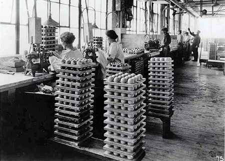 Women workers using polishing lathes during Celluloid billiard ball manufacturing