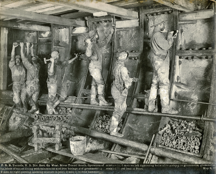 Six men working inside the tunnel