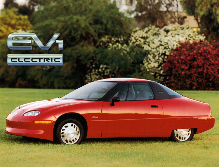 EV1 product card showing a red car parked on a wide lawn, 1996