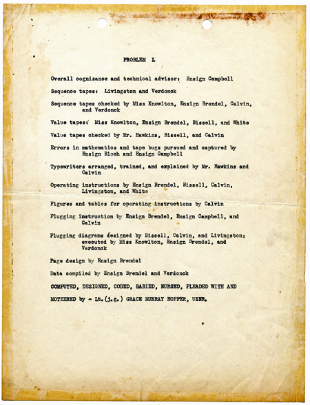 A typewritten sheet of paper delineating the work assignments on the Mark I computer for Problem L, which calculated mathematical tables that had applications in radio, sound, and frequency modulation. The last line states: computed, designed, coded, babied, nursed, pleaded with and mothered by Lt. (j.g.) Grace Murray Hopper, USNR.