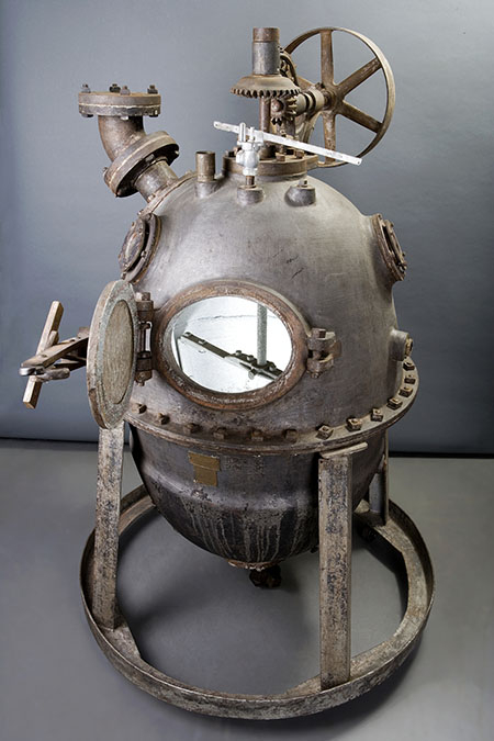 Egg-shaped metal apparatus that looks something like an old-fashioned diver’s helmet