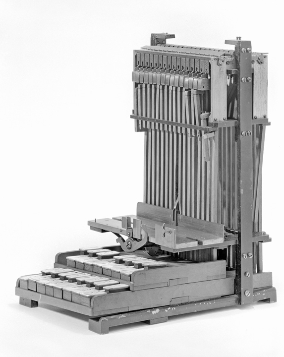 L-shaped model with piano-like keys at the bottom