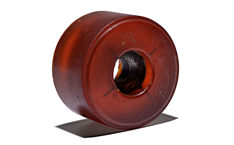 Single red urethane skateboard wheel 