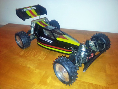 Schumacher CAT (Competition All Terrain) XLS RC car, late 1980s, shown in three-quarters profile view  from the front