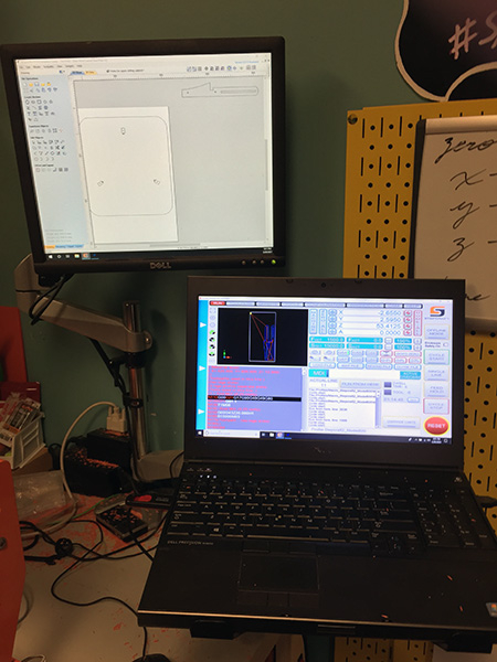 A laptop and computer monitor showing design tools