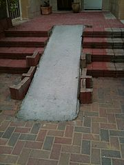 Poorly retrofitted wheelchair ramp.