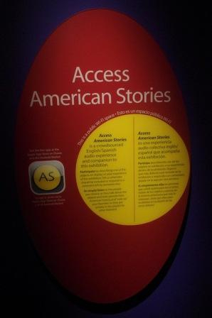 Sign announcing accessibility app in English and Spanish in American Stories