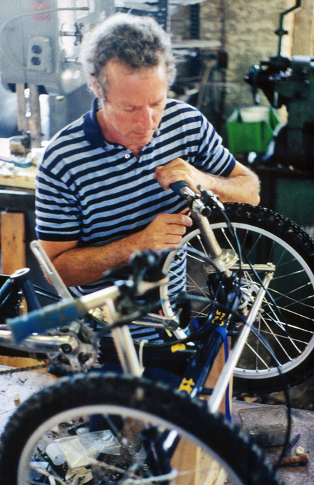 Mike Augspurger working on a handcycle wheel in his workshop