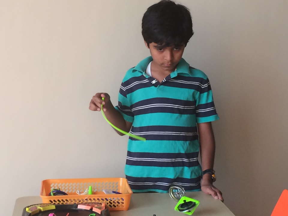 A young boy experiments with gyroscopes.