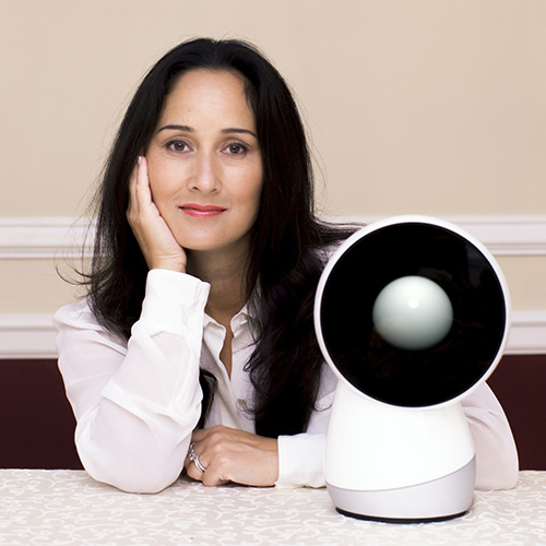 Breazeal posing with rounded robot