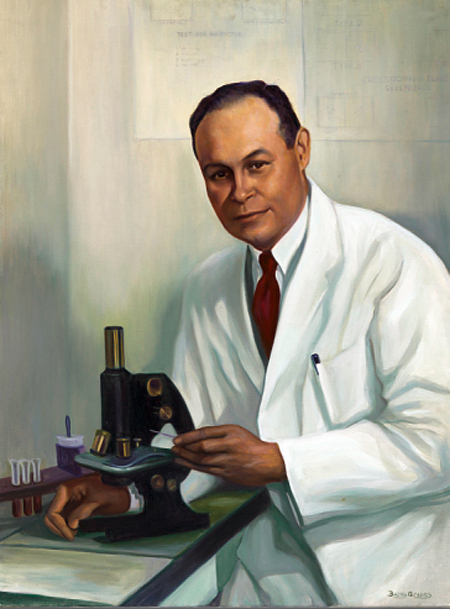 An oil portrait on canvas of Charles Richard Drew. He is wearing a white lab coat and seated at and touching a microscope, but he is looking at the painter, not through the microscope.