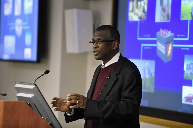 Lonnie Johnson speaking at a podium