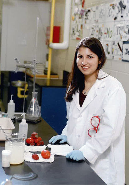 High-school-age Shukla in a chemistry lab