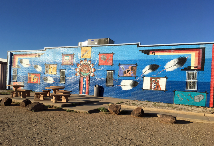 Facade of the Tohono Oodham Community College, brightly painted with Native American symbols