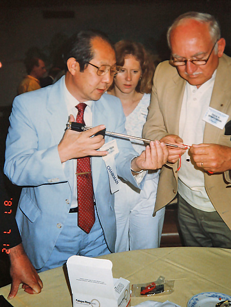 Dr. Yoon demonstrating device in convention setting