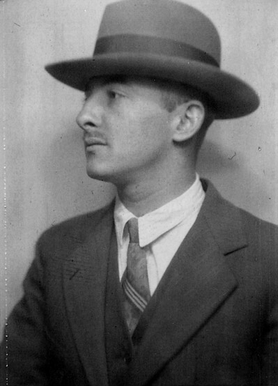 Profile portrait photo of Joseph Friedman wearing a hat