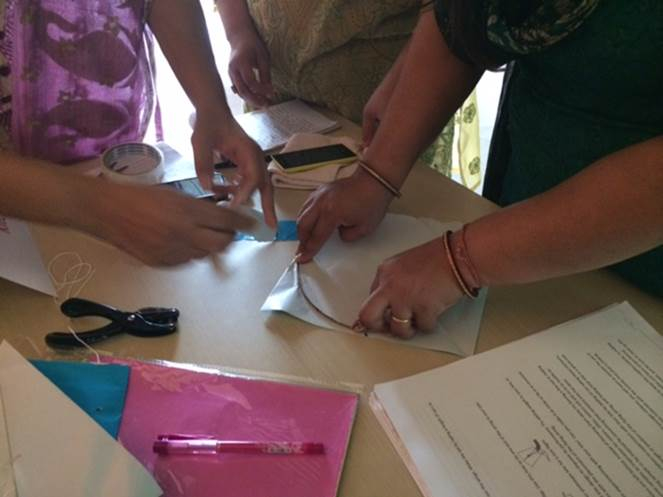 Spark!Lab India staff teach how to make a traditional Indian kite.