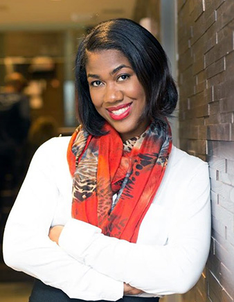 Informal pose of Tahira Reid Smith, arms folded