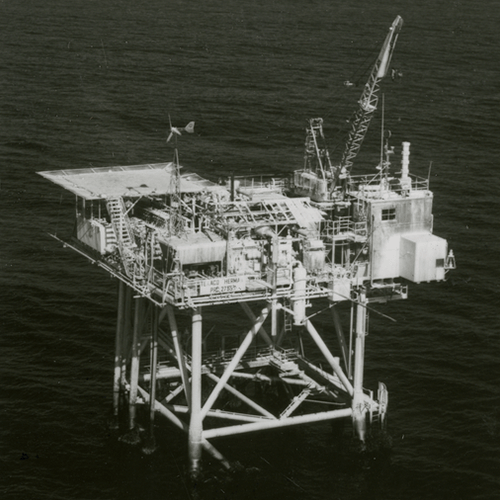 A large ship at sea seen from overhead. 